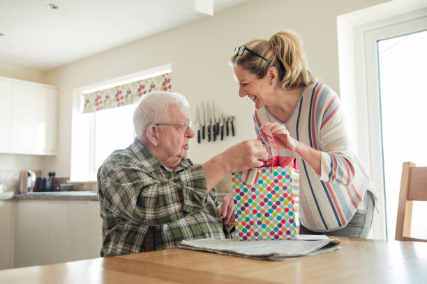 buona festa del papà! - grandparent senior adult child reading foto e immagini stock