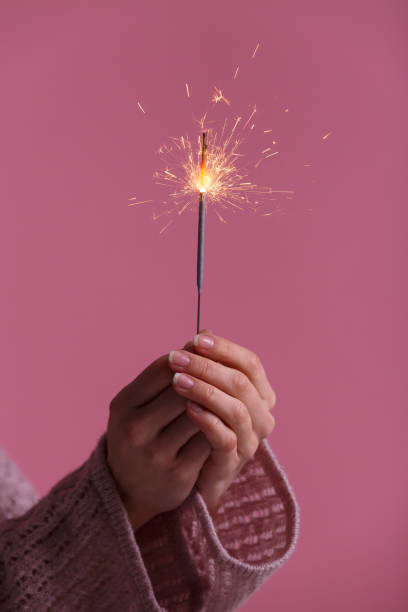 istock Female hands holding bengal light. 939597136