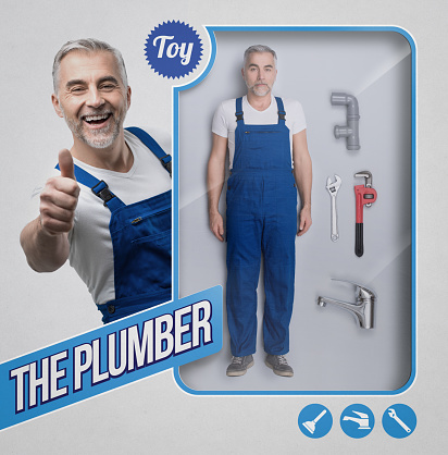 Realistic plumber and repairman doll with work tools and smiling character giving a thumbs up on the see through packaging