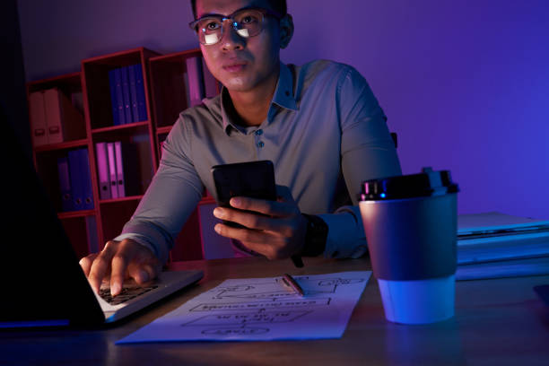 istock Asian Manager Working Late in Office 939601894