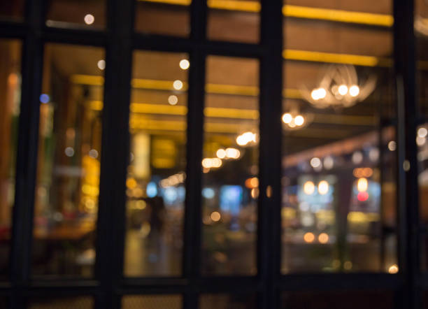 istock Blurred background: Restaurant with tables and chairs blur background. 939606186