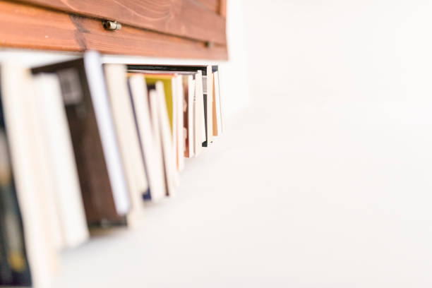 istock High tower of books in the corner 939606346