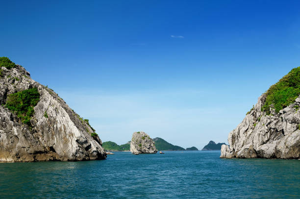 Beautiful scenery with limestone islands raising in the ocean at Halong Bay in Vietnam.