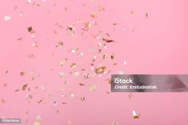 Golden Confetti On Pink Background Stock Photo - Download Image Now - Confetti, Birthday, Pink Color