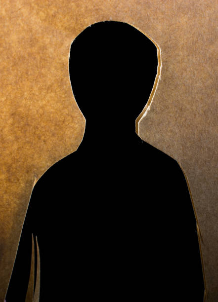 istock Man shape cut out of paper in hand 939611134