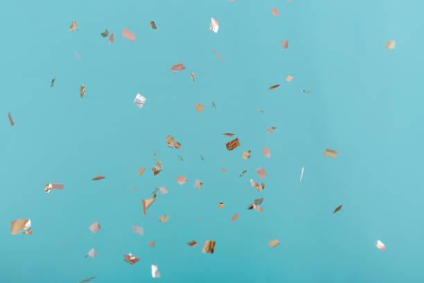 istock Golden confetti on pink background 939613196