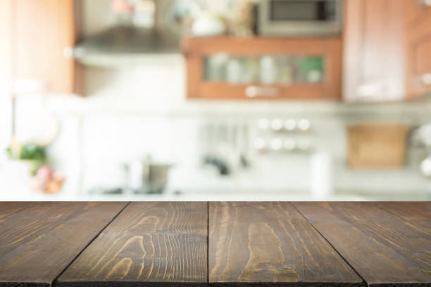 istock Blurred background. Modern kitchen with tabletop and space for you. 939615986