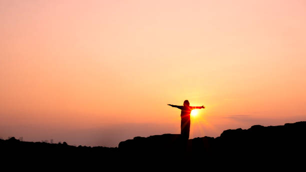 istock Silhouette young woman practicing yoga 939616728