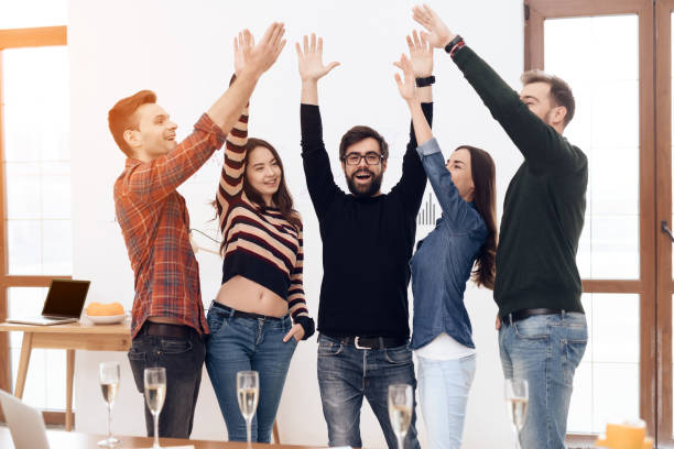 istock A group of young office workers celebrating. 939621096