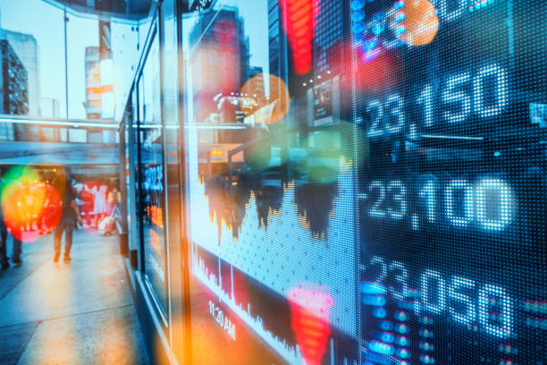 istock Display stock market numbers with city light reflections 939625292