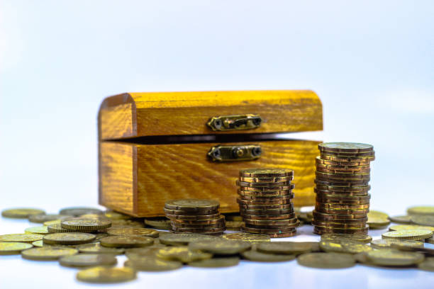 Economy and wealth. Money, financial, business growth concept by putting coin in the treasure chest open gold ira stock pictures, royalty-free photos & images