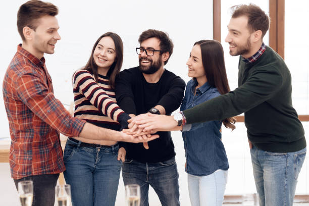 istock A group of young office workers celebrating. 939627142