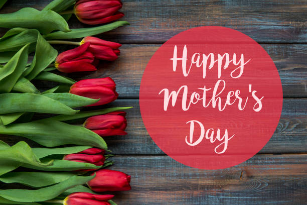 istock Happy Mother's Day card with red tulips 939636814