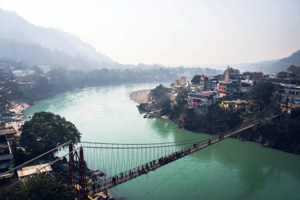 ram jhula is an iron suspension bridge situated in rishikesh - garhwal imagens e fotografias de stock