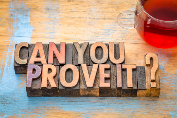 Can you prove it? Word abstract in wood type. Can you prove it? A question in vintage letterpress wood type with a cup of tea.. printing block photos stock pictures, royalty-free photos & images