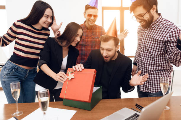 istock The office staff surprises their manager. 939644762