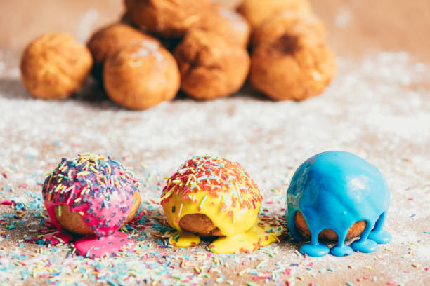 istock Three homemade doughnuts on a dirty counter 939658722