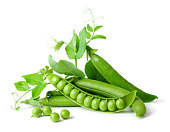 Green peas in pods freshly picked with leaves on white background