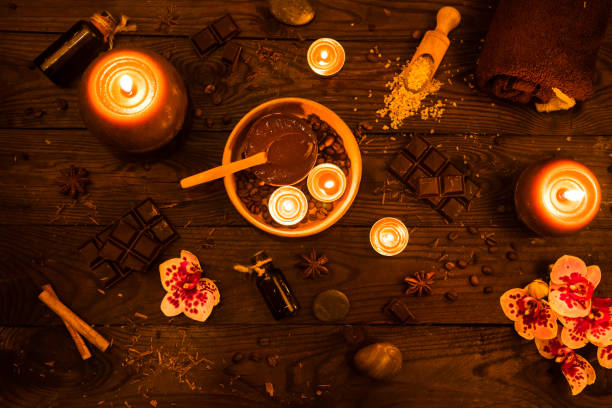istock Spa concept with chocolate and candles on a wooden background. 939659644