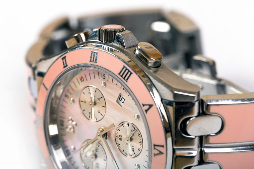 Luxury woman pink watch. Macro shot close up