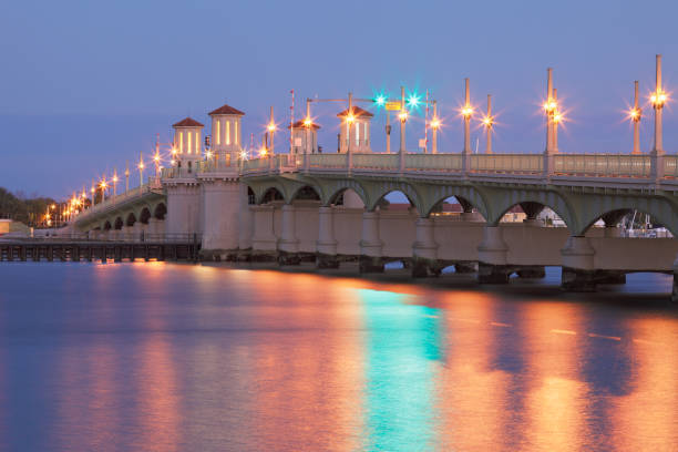 Bridge of Lions - St. Augustine - Florida The Bridge of Lions (c. 1927) in St. Augustine, Florida - known as "The Most Beautiful Bridge in Dixie” - is a drawbridge spanning the Matanzas River between downtown St. Augustine and Anastasia Island. Listed on the National Register of Historic Places, It has been a symbol of the nation's oldest city. bridge of lions stock pictures, royalty-free photos & images