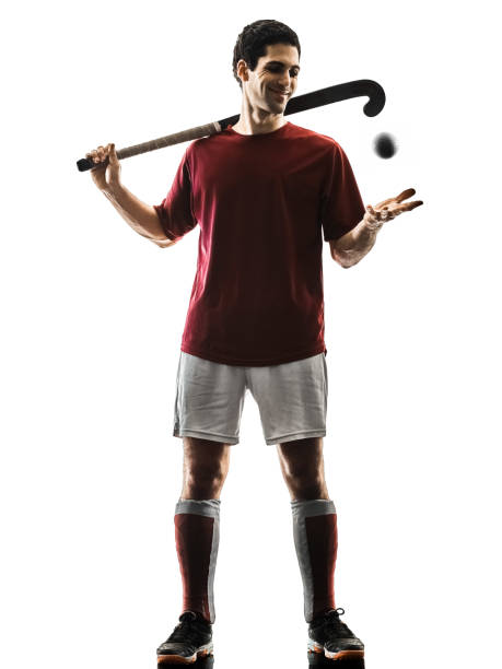 istock field hockey player man isolated silhouette white background 939668870