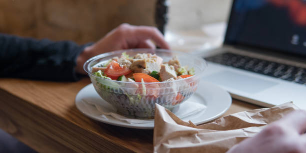istock Take away salad with  tomatoes and chicken in plastic packaging. A useful snack for office workers in the workplace 939669754