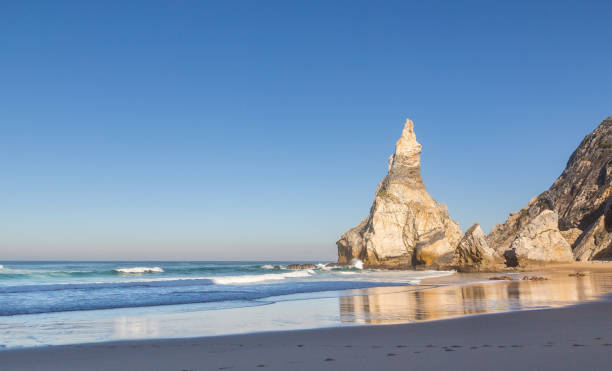 istock Praia da Ursa beach with rocks in Portugal 939675052