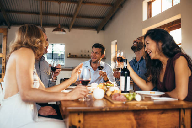 istock Friends enjoying dinner party at home 939675166