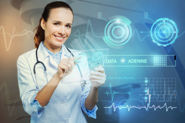 istock Smiling doctor looking happy while standing with a transparent device 939675558