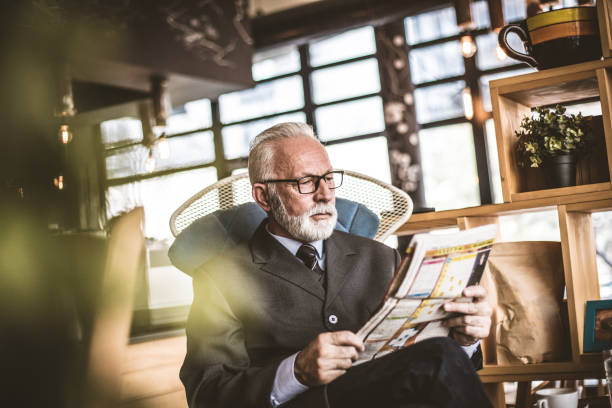 istock Time for relax. Senior businessman riding newspaper. 939678488