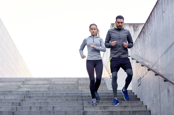 istock couple walking downstairs on stadium 939678502