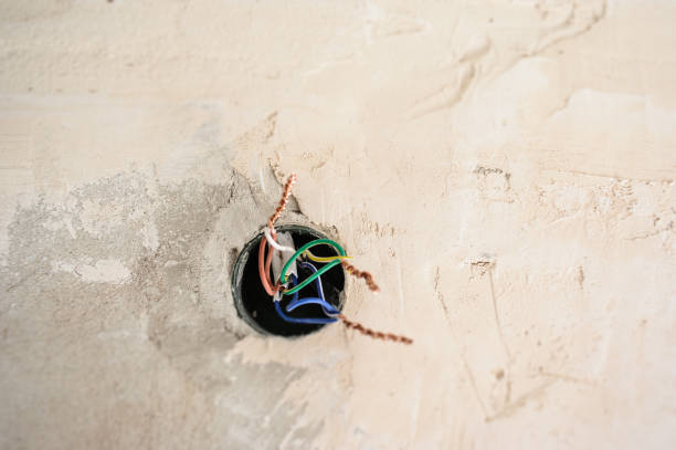 istock Electrical renovation work on old house installing new power lines cables 939678988