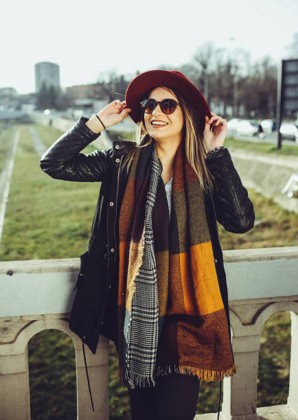 istock Young beautiful woman posing outdoor 939679156
