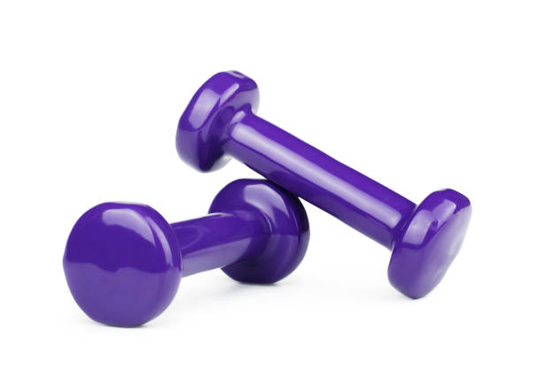 istock Two purple dumbbells isolated on white background 939687312