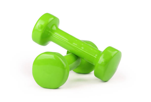 istock Two green dumbbells isolated on white background 939687374