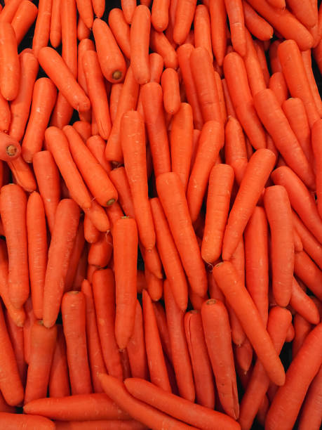 istock Carrots in a vegetable market. 939687568