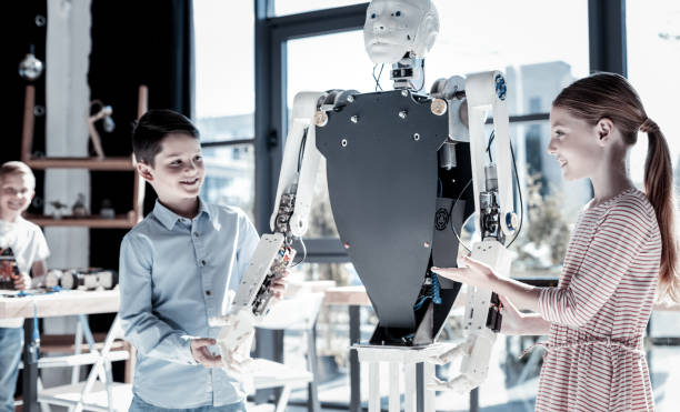 Friendly kids discussing human like robot