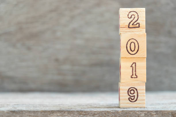 istock Letter block in 2019 word on wood background with copy space 939698998
