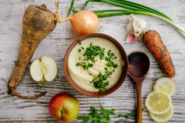 istock Parsnip cream soup with raw vegetables 939705626