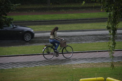Brunssum, the Netherlands, - November 19, 2012. Cyclists riding in the rain on an late summer day.