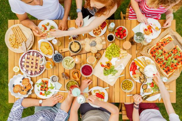 istock Vegan friends eating healthy lunch 939722256