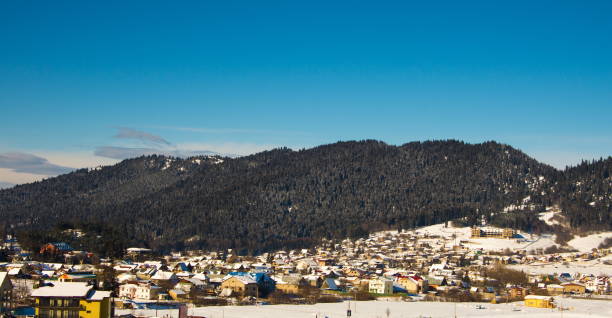 istock Panoramic View Of Town Against Clear Blue Sky 939722366