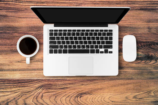 istock Office desk top view with laptop, coffee and mouse. Flat layout. 939731512