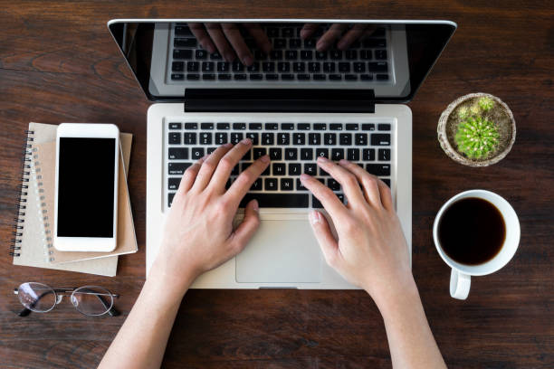 istock Man is typing on laptop computer. Top view, flat lay. 939731560