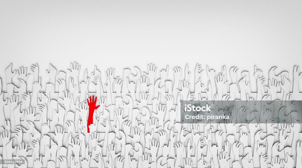 Sea of hands A red hand standing out from a sea of white hands, paper cut-out, 3D Standing Out From The Crowd Stock Photo