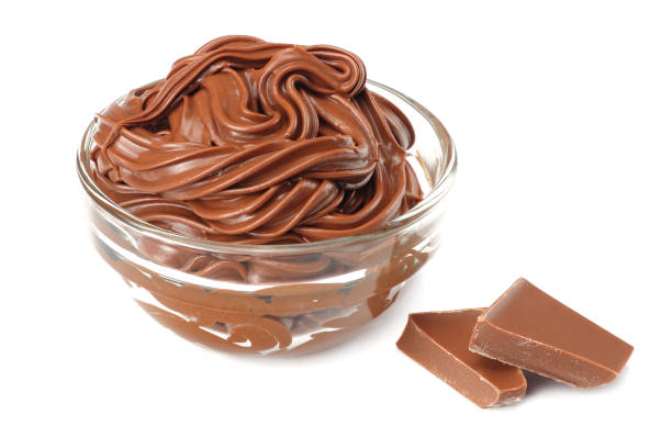 istock chocolate cream isolated on white background. cream in glass bowl 939751324
