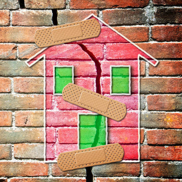 istock Renovation of cracked brick wall - concept image 939753466