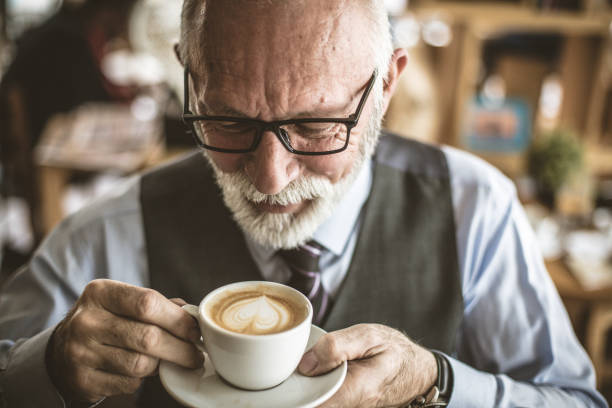 istock Close up image of senior businessman drinking coffee. 939753508