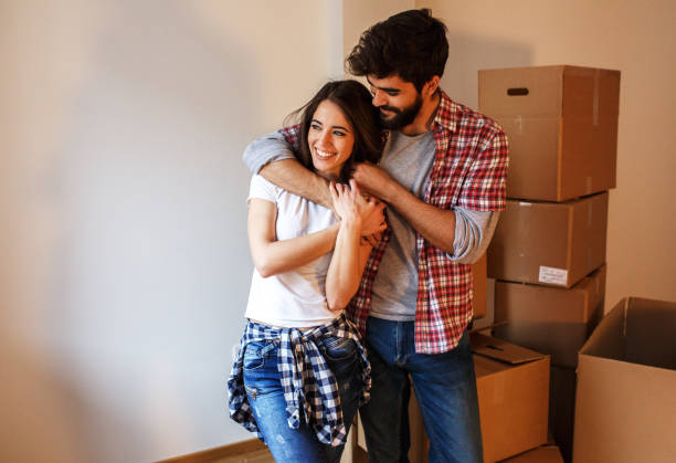 istock Young couple moving into a new home. 939753858